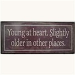 Metalskilt Young at heart. Slightly older in other places